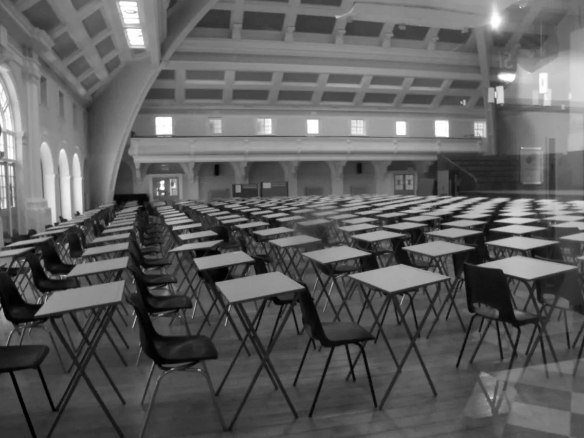 Empty Exam hall with desks in rows